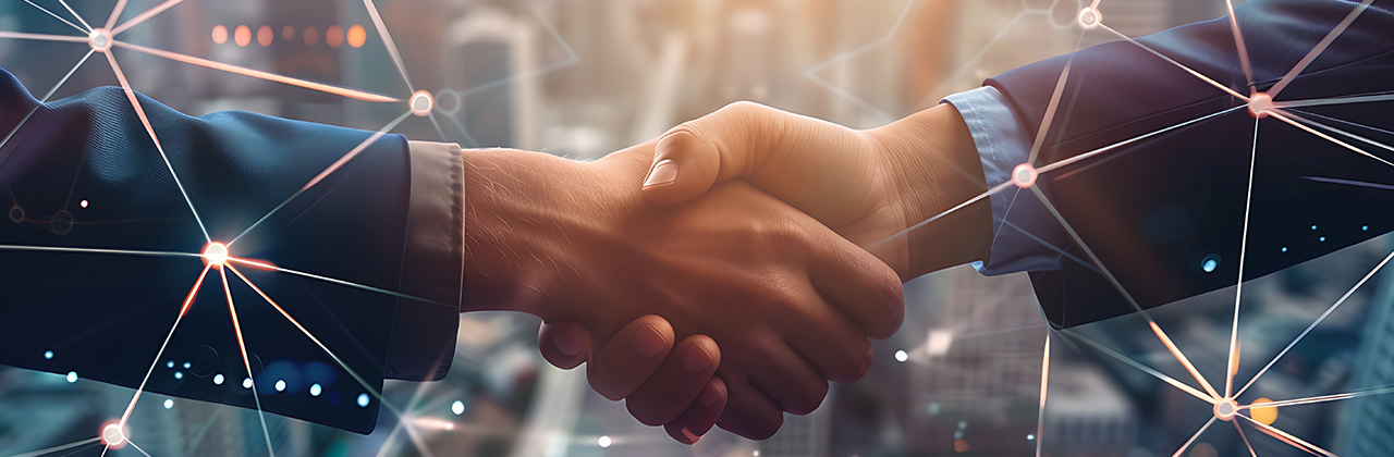 Hands shaking representing Juniper Partner of the Year Axians UK 2023